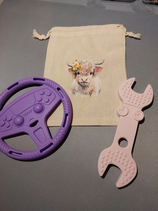 Silicone teether set with bag.